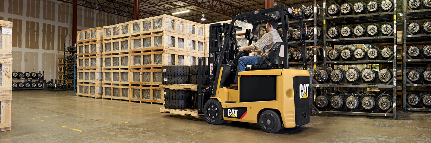 Operator Moving Tires with a CAT Lift Truck