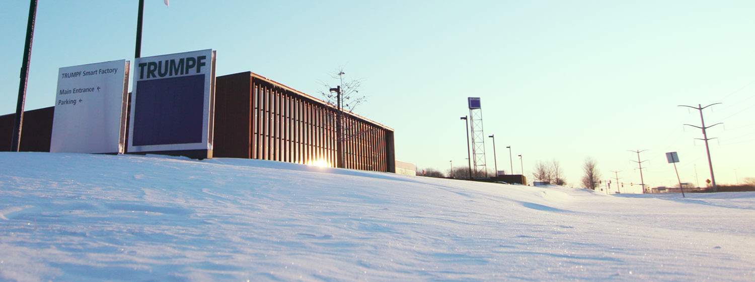 snow covered Trumpf smart factory building