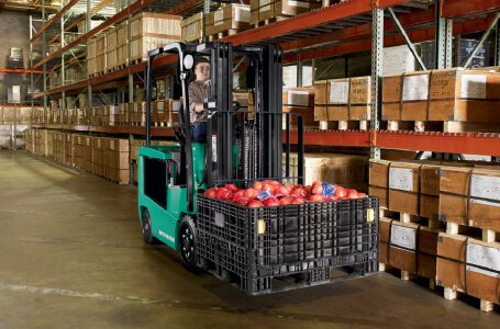 Forklift operator carrying food items