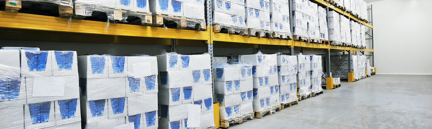White boxes stacked on warehouse shelves
