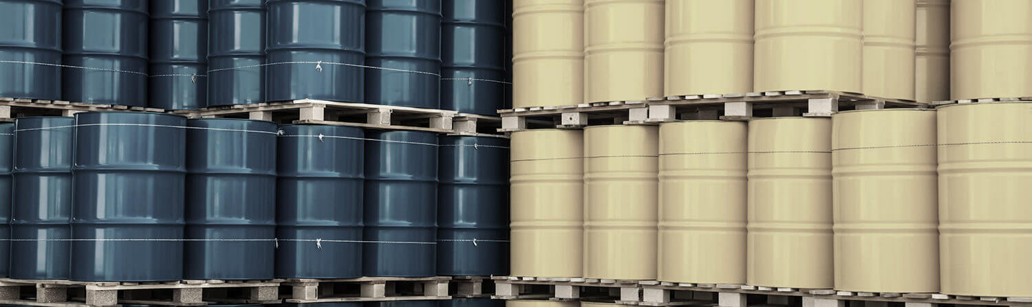 Blue and yellow barrels stacked next to each other